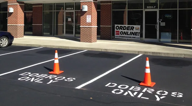 Repaired lot striped and marked off with safety cones