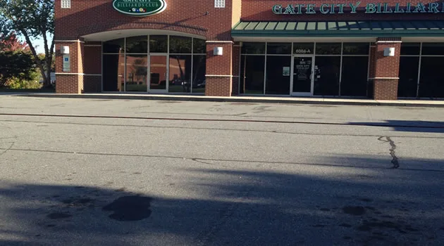 Freshly sealed and restored commercial parking surface