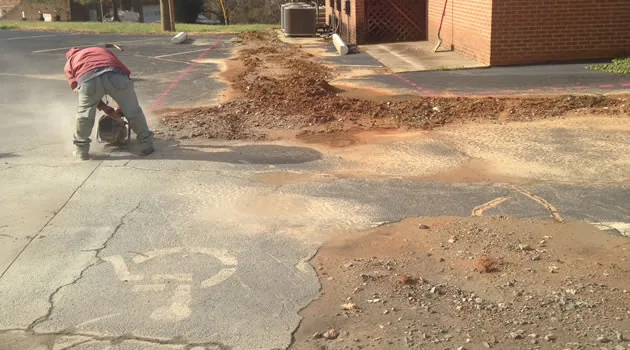 Excavated section of asphalt opened for a utility line repair
