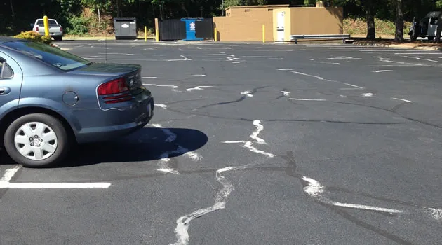 Repainted crosswalk and stall lines at a retail center entrance