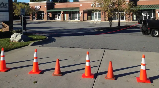 Safety cones protecting freshly painted parking-lot striping